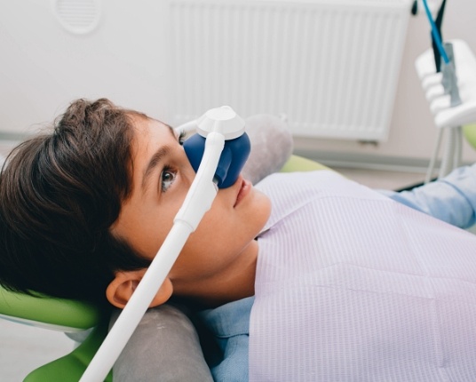 Patient receiving nitrous oxide sedation dentistry treatment