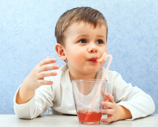 Patient drinking oral conscious dental sedation medication in juice