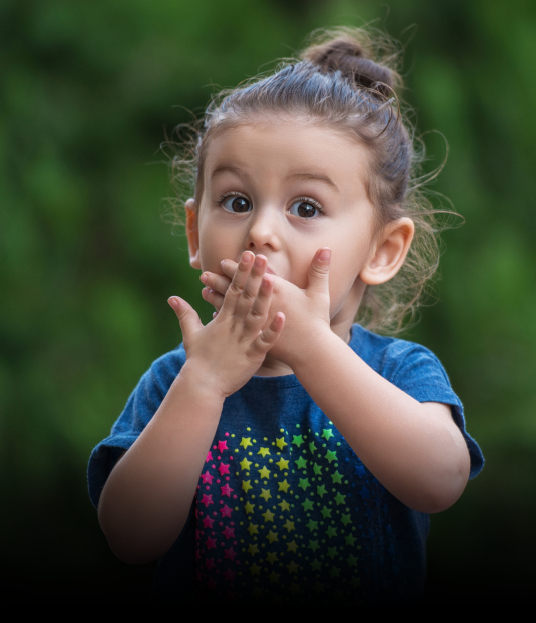 Child covering smile before emergency dentistry