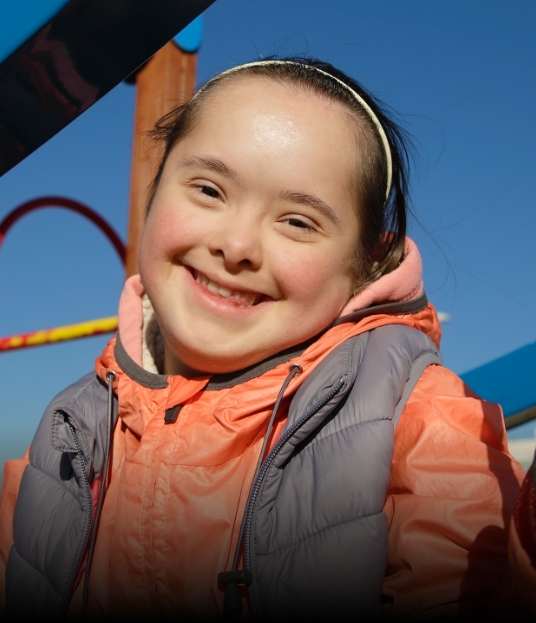 Young girl smiling after special needs dentistry