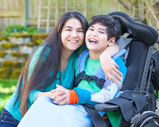 Mother and child smiling after special needs dentistry visit