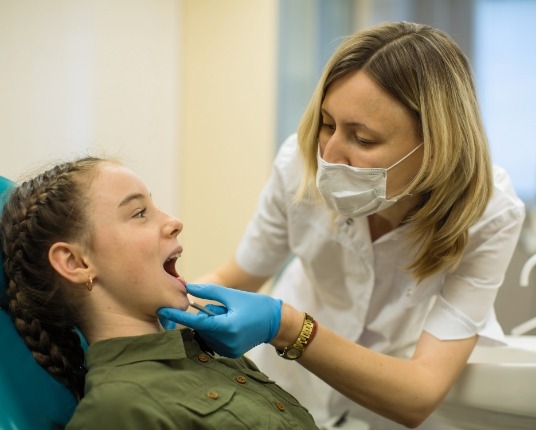 Child receiving additional medical screening during pediatric dentistry visit