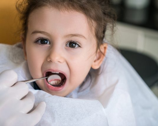 Child examined during dentistry for toddlers appointment