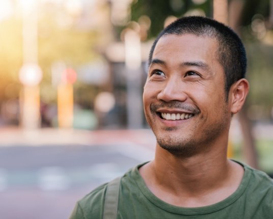 Young man smiling after dentistry for teens appointment