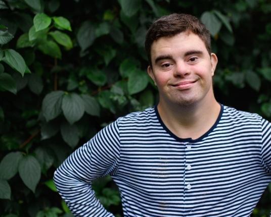 Young man sharing smile after special needs dentistry visit