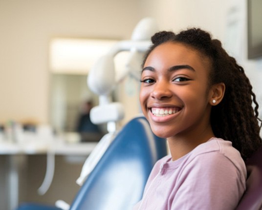 teen girl smiling in dental office   