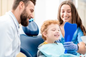 a child receiving help from their dentist during a tooth extraction