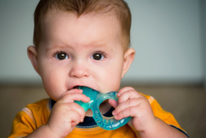 a child using a teething ring