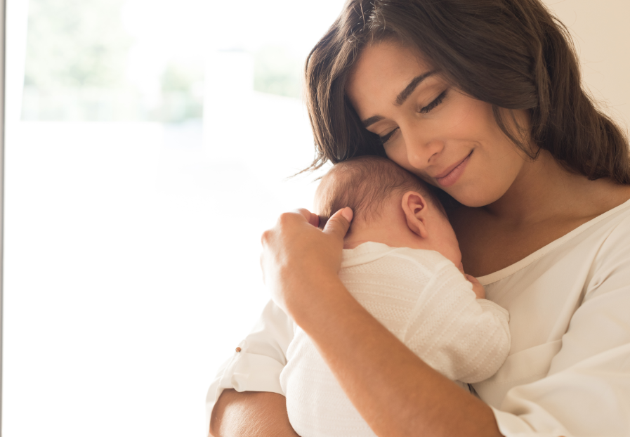 Mom cradling baby